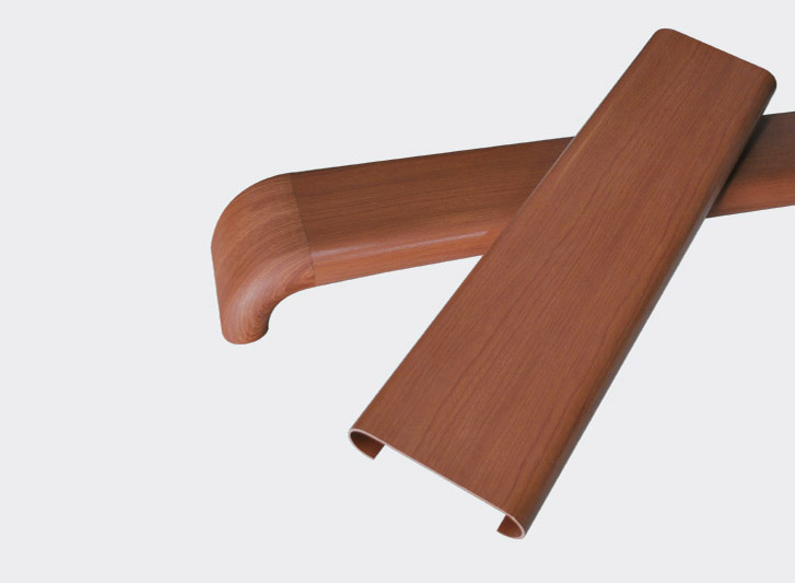 A pair of wooden handles with pvc hand rails on a white background.