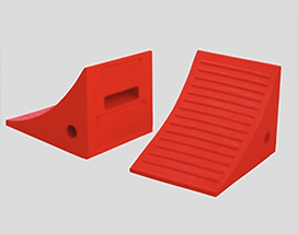 Two red plastic ramps on a gray background, showcasing Warrior WPS.