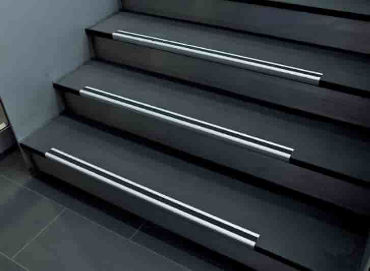 Stainless steel stair treads with aluminium stair nosing.