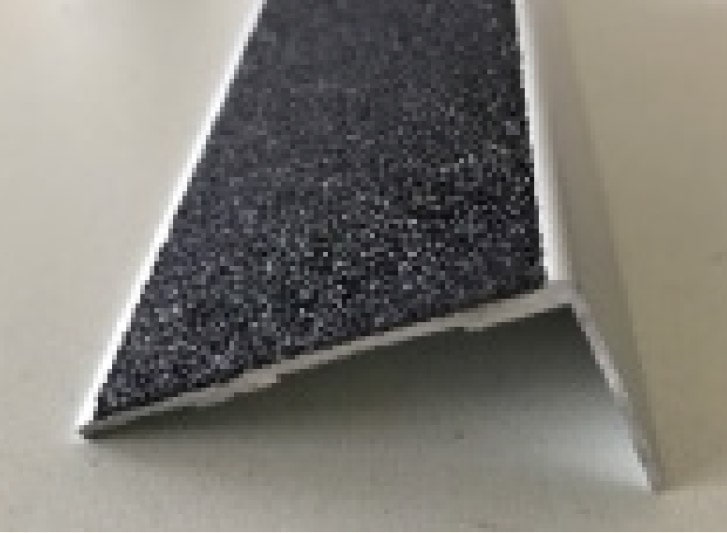 A black and white piece of plastic on a table.