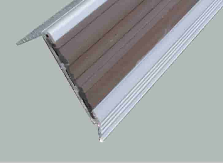A close up view of a door with an aluminium strip.
