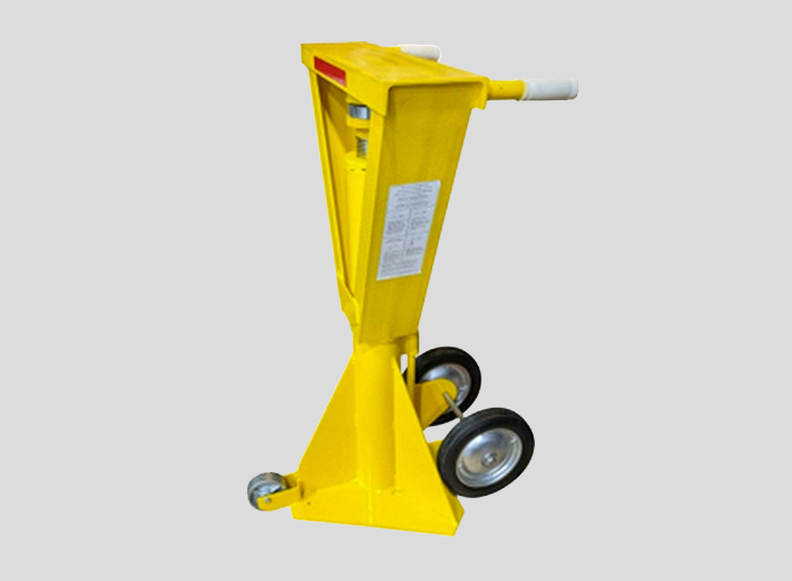 A yellow jack with wheel clamps on a gray background.