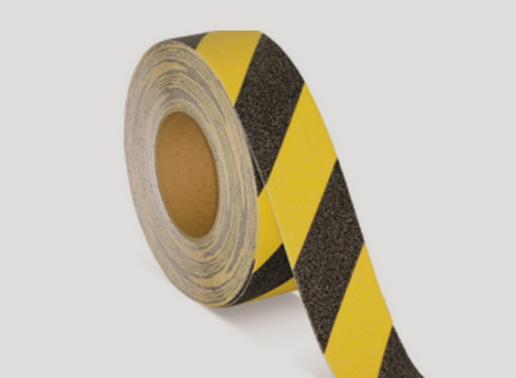 A roll of yellow and black striped antislip tape.