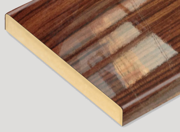 A close up of a wooden shelf with a gold trim. The shelf is enhanced by wood corner guards and wall guards, adding an additional layer of protection and style. Handrails are thoughtfully incorporated,