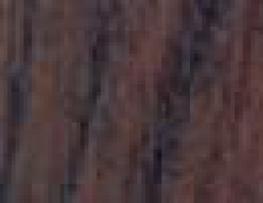 A close up image of a dark brown wood texture featuring Wood Corner Guards.