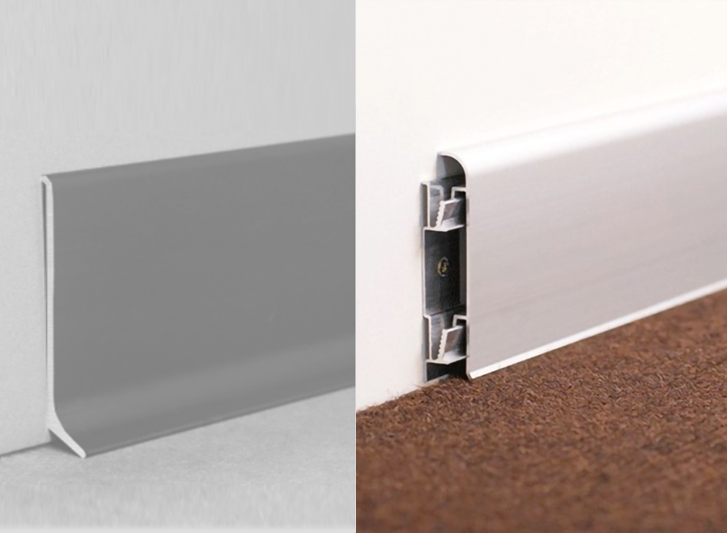 A picture of a doorway with a white and grey strip, featuring aluminium skirting.