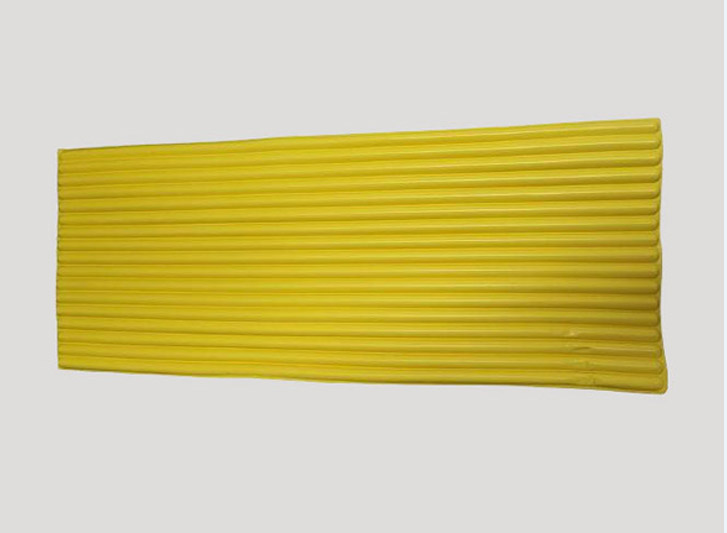 A yellow foam corner guard on a white background.