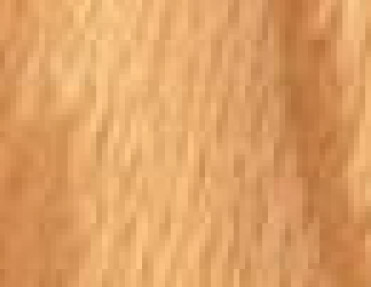 A close up image of a wooden floor with Wood Corner Guards.