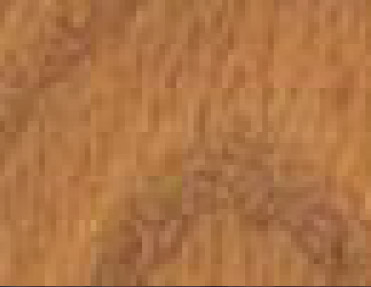 A close up image of a wooden floor with Wood Corner Guards.