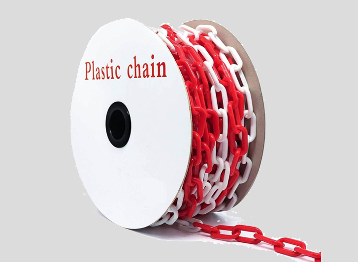 A spool of red and white plastic chain for dock bumpers.