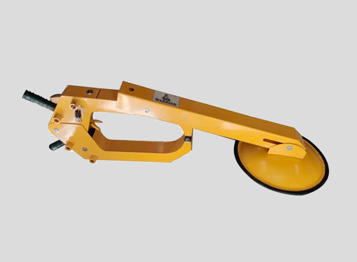 A yellow tool with a round object, typically used as a wheel chock or dock bumpers.