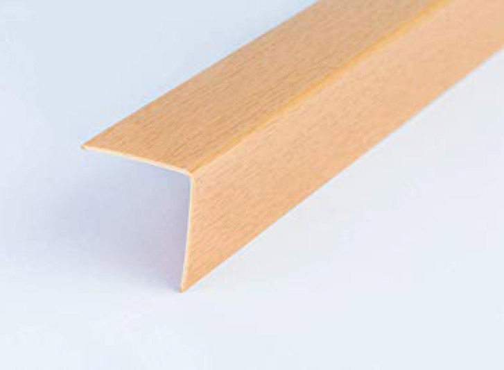 A wood corner guard on a white surface.