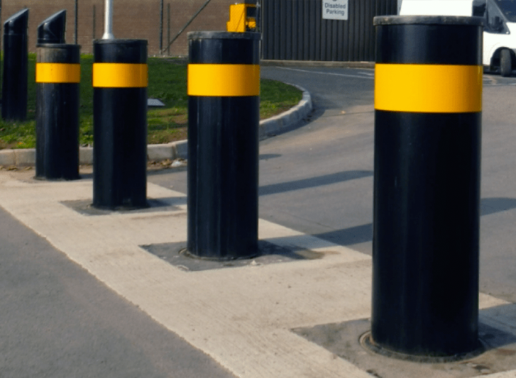 A group of stainless steel bollards.