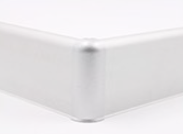 A close up of a corner featuring aluminium skirting.