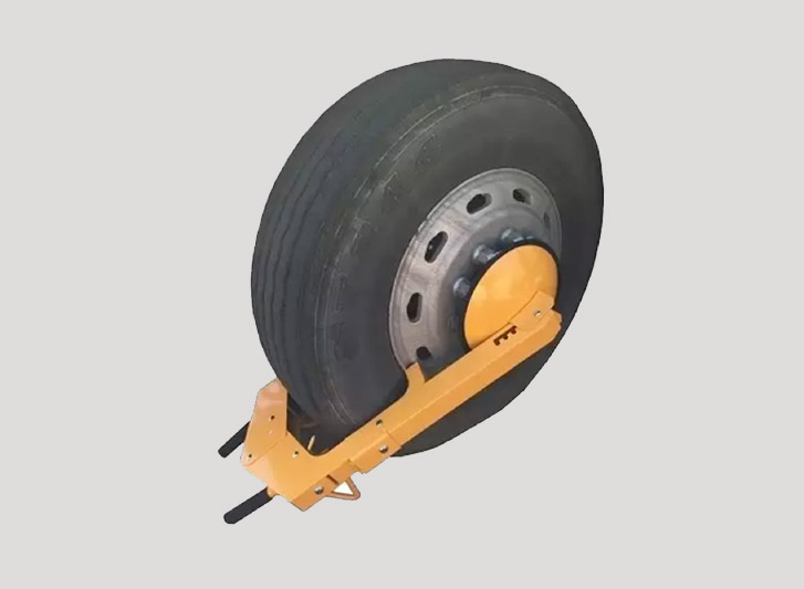 A yellow wheel chock with a yellow handle attached to it.