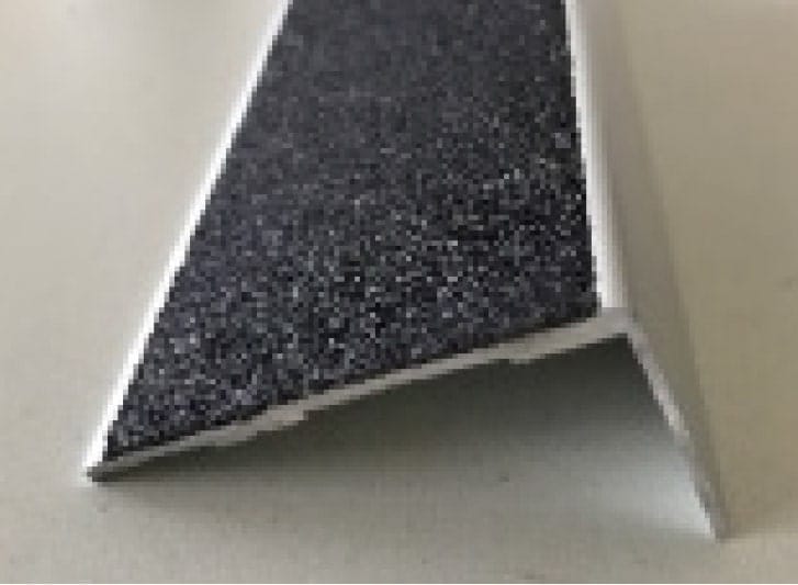 A black and white piece of plastic on a table.