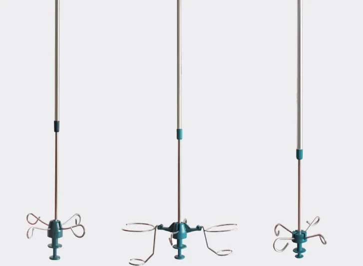 A group of blue and white hanging lights on curtain rails.