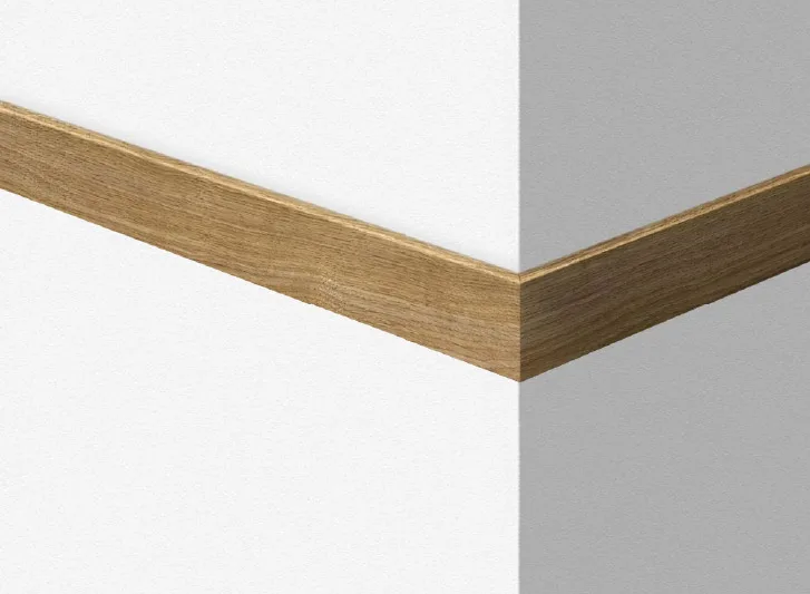 A corner of a white wall with a wooden trim, featuring Wood Corner Guards.