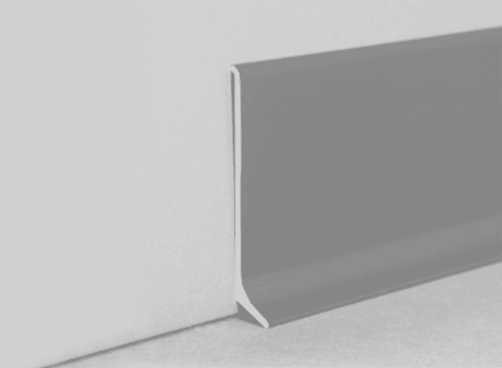 An image of a grey corner of a wall with aluminium skirting.