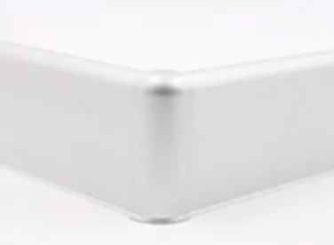 A close up of a corner featuring aluminium skirting.