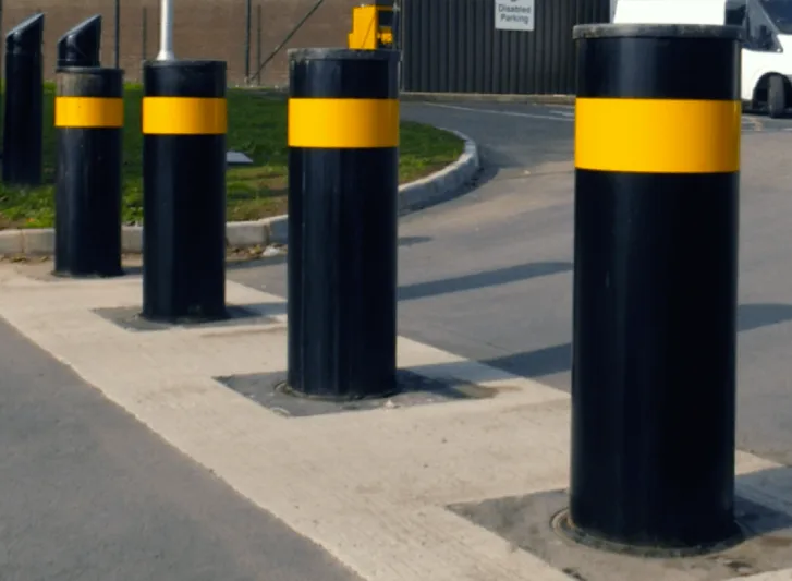A group of stainless steel bollards.