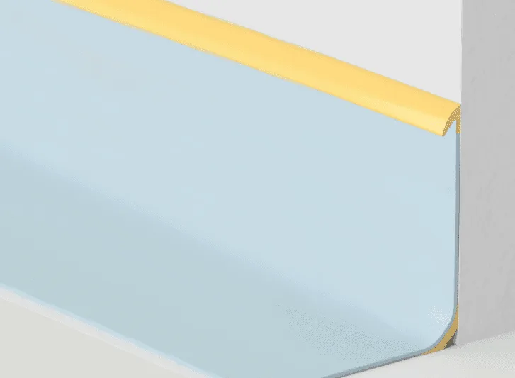 A blue and yellow corner of a wall with aluminium skirting.