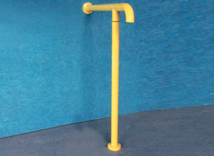 A yellow handrail against a blue wall, providing stability and support for individuals in hospital environments or aging individuals using toilets and bathrooms.